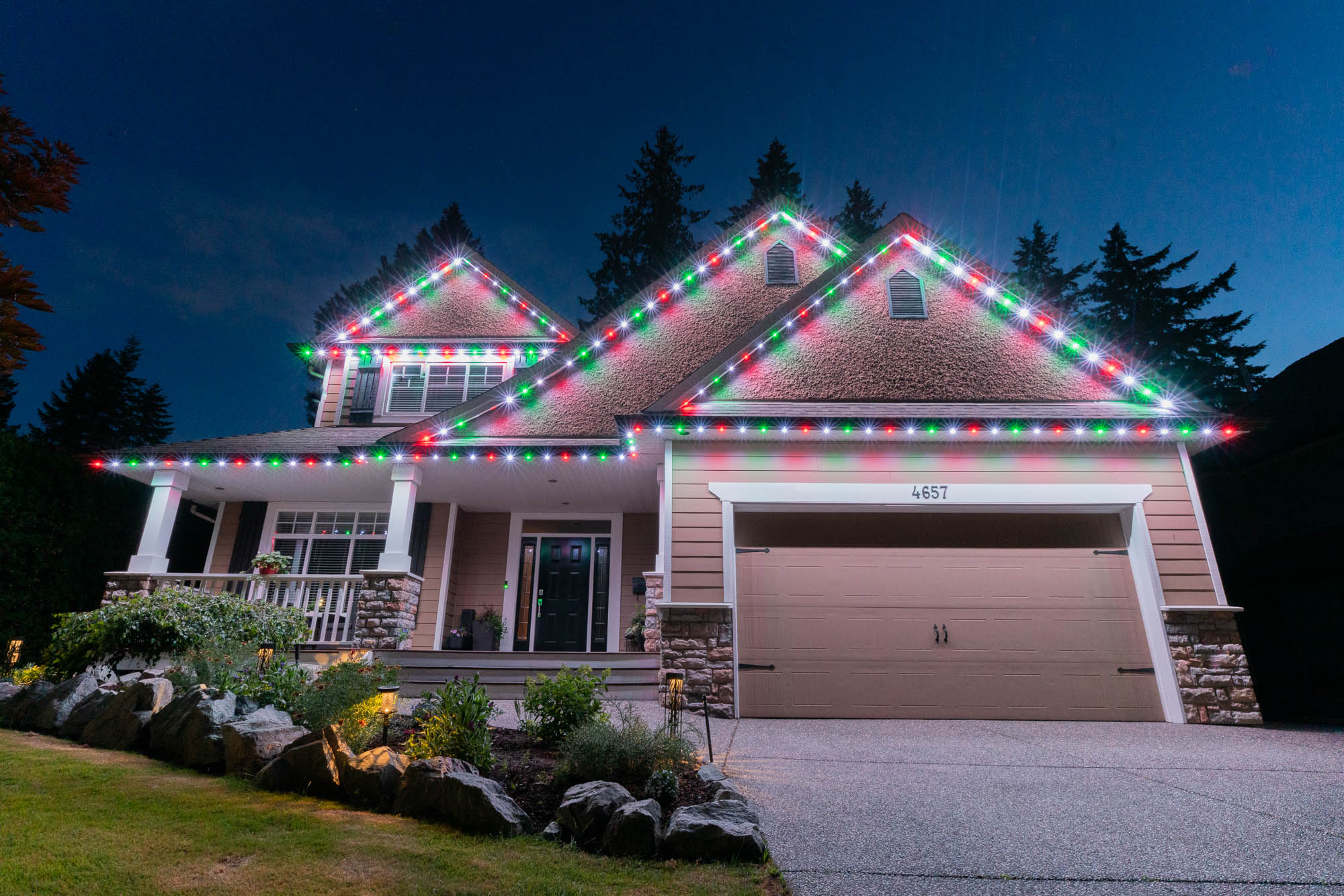 Colour-changing permanent lighting illuminating the front of a home